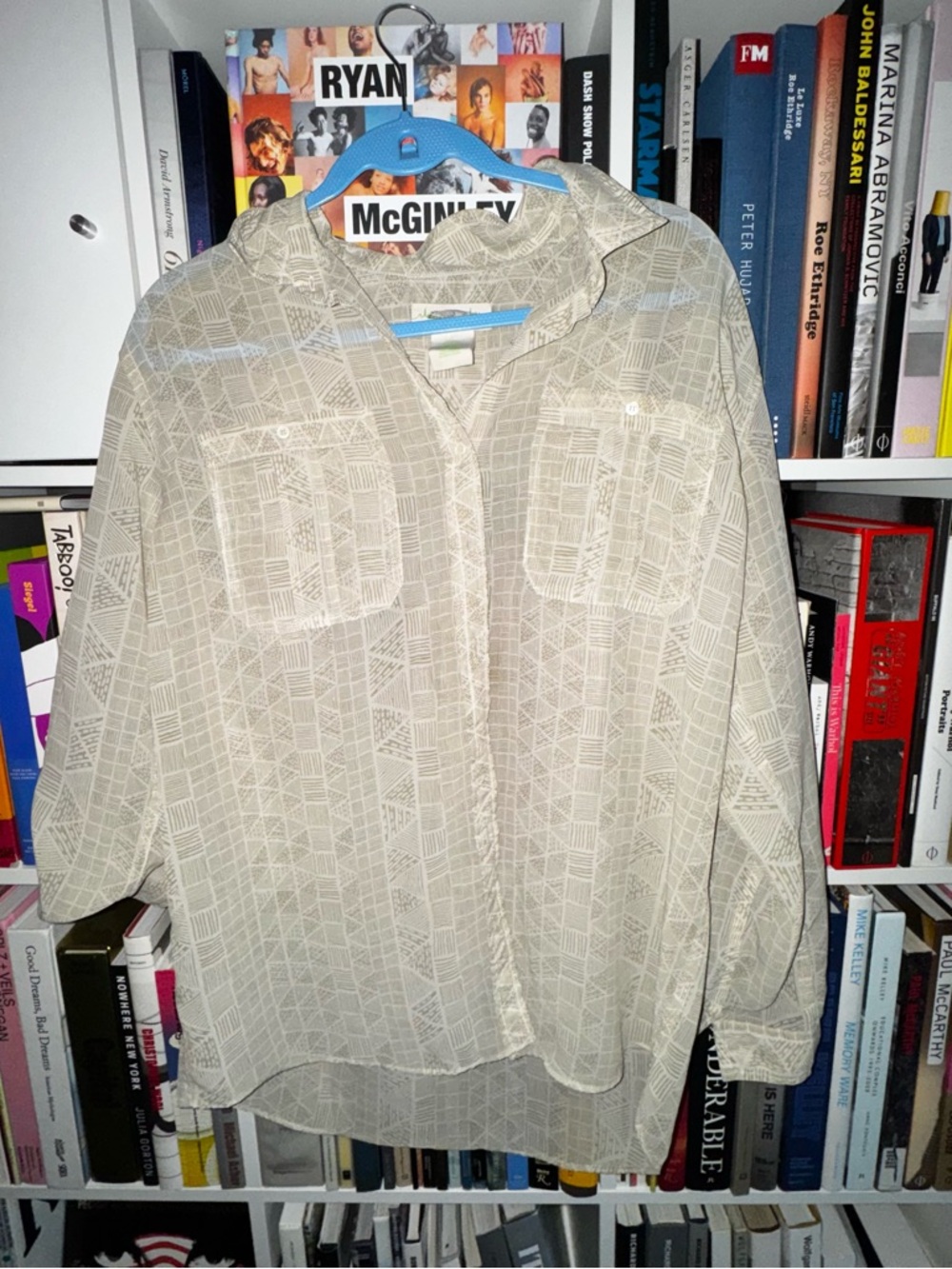 Woman’s sheer oversized button down